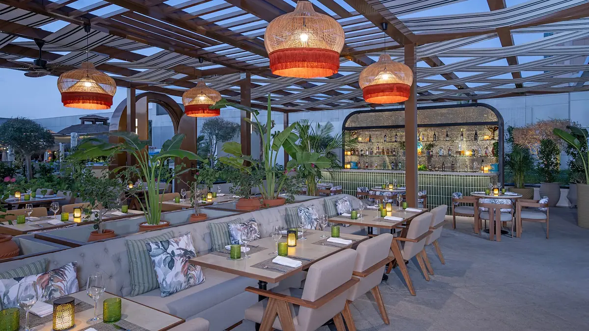 Ballarò terrace with rattan lanterns at Conrad Dubai