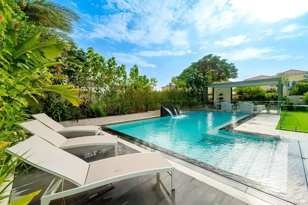 Private villa garden and pool with a pergola in Dubai